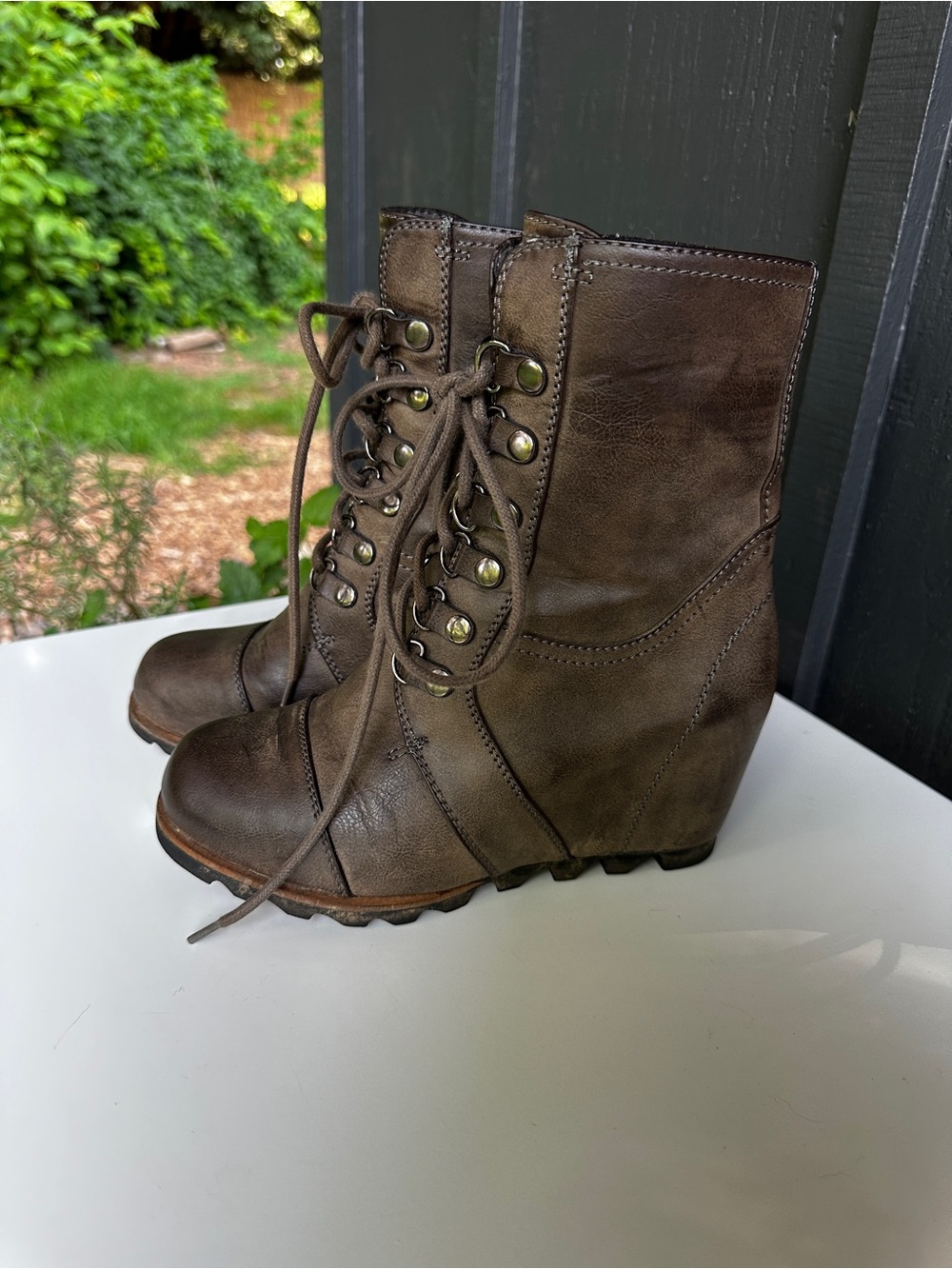 Target lace-up wedge boots olive green, in the style of Sorel